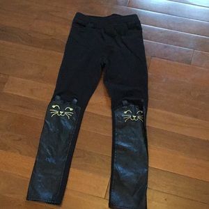 Black and gold faux leather cat leggings